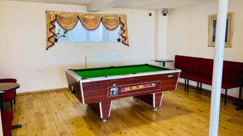 a room with a pool table in a room at Hotel Maria in Sandown