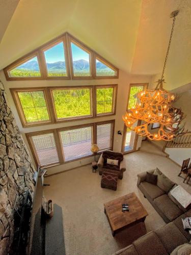 an overhead view of a living room with large windows at M1 Luxury home a short walk from the Mount Washington Hotel AC heated floor stunning views in Carroll