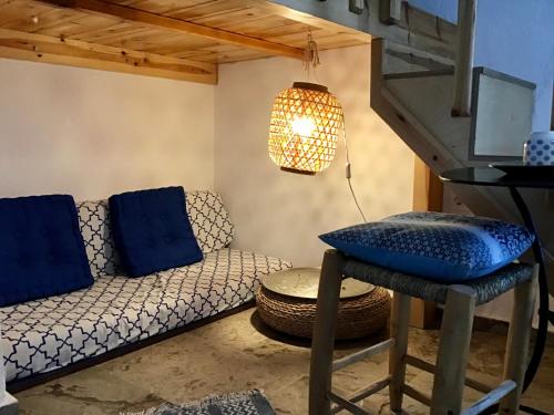 a living room with a couch and a table at Chez Cécile Home in Mochlos