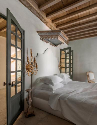 Katil atau katil-katil dalam bilik di Les Maisons de l'Hôtel Particulier