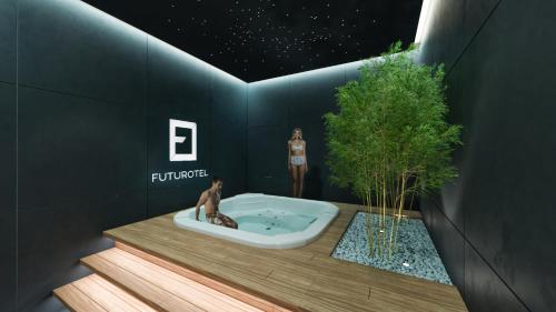 a bathroom with a tub with two dolls in it at Futurotel Malagueta Beach in Málaga