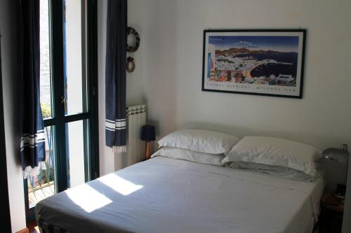 Posteľ alebo postele v izbe v ubytovaní Casa Ziguratt Carloforte
