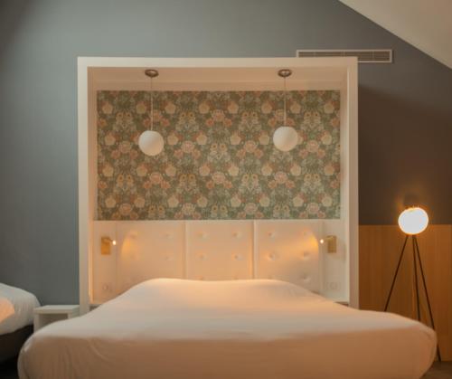 a bedroom with a white bed and a floral wall at CALM Appart' & Hostel in Lille