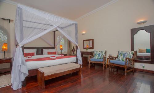 Ένα ή περισσότερα κρεβάτια σε δωμάτιο στο Mzima Beach Residences - Diani Beach