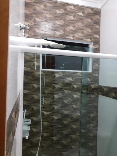 a kitchen with an oven with a glass door at Pousada Enseada de Bertioga in Bertioga