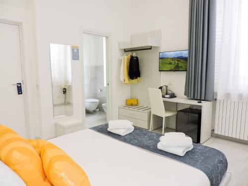 Кровать или кровати в номере Villa Gabriella - Rooms & Breakfast