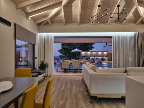 a living room with a couch and a table at Villa Fabiana in Kipseli