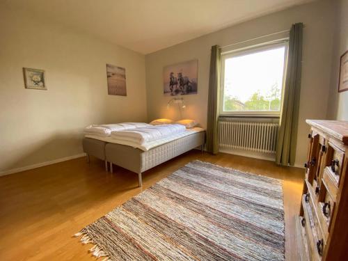 Кровать или кровати в номере B&F Lägenheter