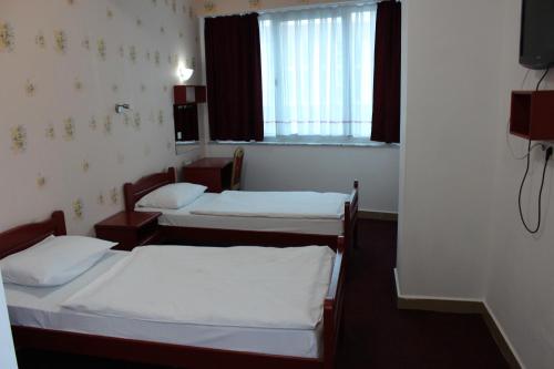 Postel nebo postele na pokoji v ubytování Hotel BM International