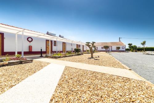 an empty street in front of a building at Monte do Zeca in Zambujeira do Mar