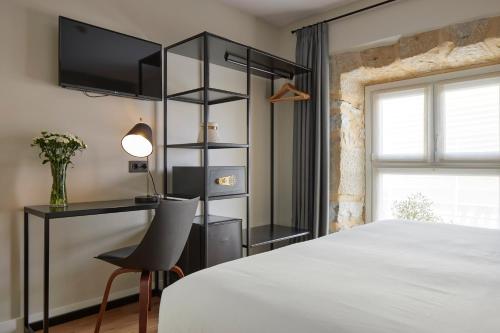 מיטה או מיטות בחדר ב-Hotel Arrizul Beach
