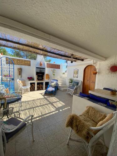 a living room with a dog laying on a couch at Casa Aleg in Albufeira