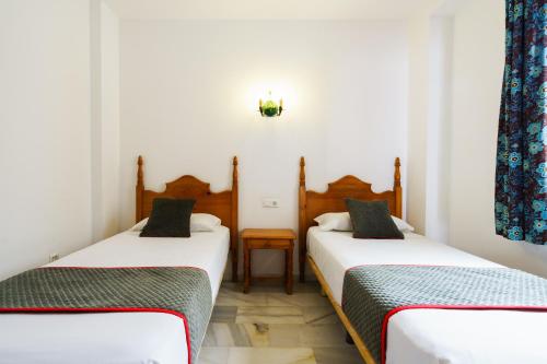 Katil atau katil-katil dalam bilik di Apartamentos Pepe Mesa