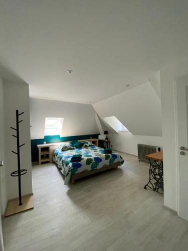 Ένα ή περισσότερα κρεβάτια σε δωμάτιο στο Chambres d'hôtes Le Petit Roche