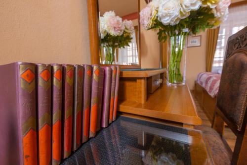 a row of books sitting on top of a table at Penzion U Hrádku in Kutná Hora