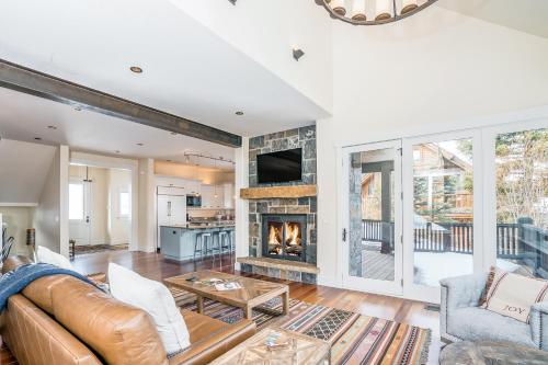 a living room with a couch and a fireplace at Adams Ranch Rd - 247 in Telluride