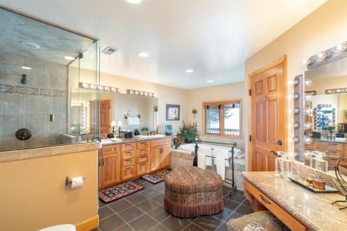 a large bathroom with a sink and a shower at Double Eagle Way 102 in Telluride