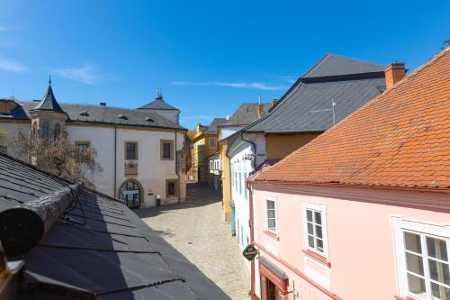 a view of a street in a town with buildings at Penzion U Hrádku in Kutná Hora