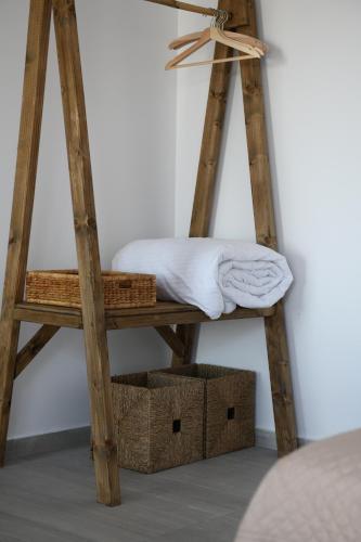 a wooden ladder with a bed on top of it at The Hidden Gem in Skiathos Town