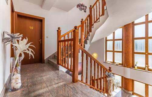 a staircase in a home with wooden railings at Villa San Rocco Bed & Breakfast in Medulin
