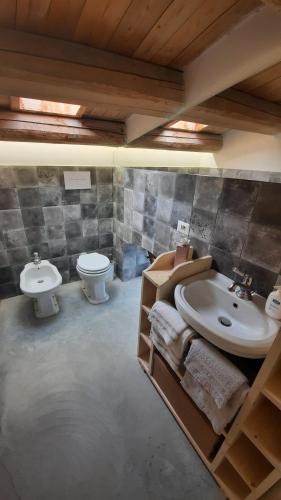a bathroom with a sink and a toilet at Landolina Guest House in Donnalucata