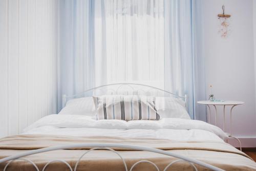 Ένα ή περισσότερα κρεβάτια σε δωμάτιο στο Apartament Monopoli