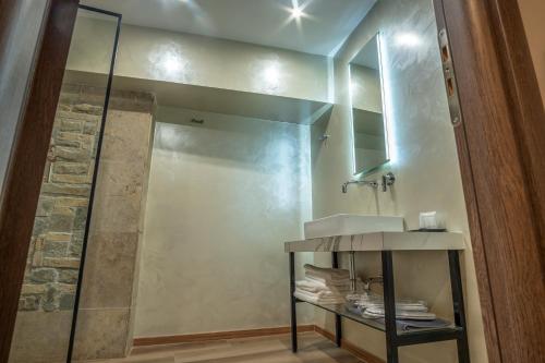 a bathroom with a sink and a mirror at Philia Boutique Hotel in Athens