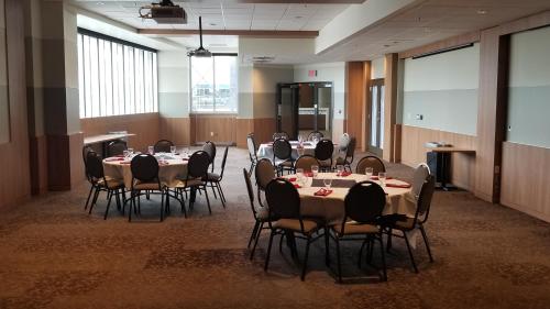 a conference room with tables and chairs in it at Canad Inns Health Sciences Centre in Winnipeg