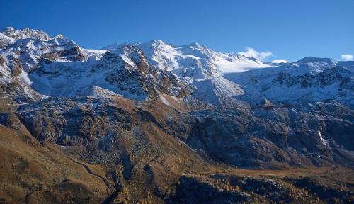 an aerial view of a mountain range with snow at Hotel Martellerhof in Martello