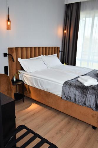 Postel nebo postele na pokoji v ubytování Patio Riverfront Aparthotel