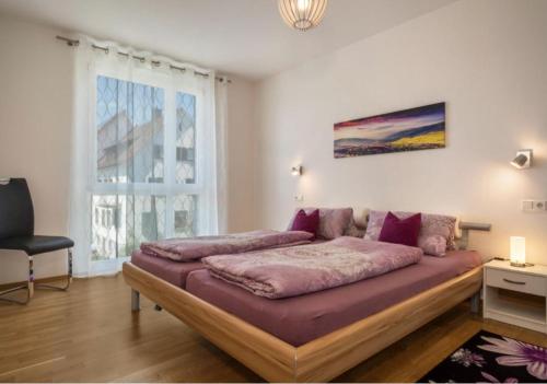 Кровать или кровати в номере Iluna