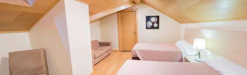 Ένα ή περισσότερα κρεβάτια σε δωμάτιο στο Hotel Meson de Erosa