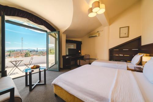 Ένα ή περισσότερα κρεβάτια σε δωμάτιο στο Hotel Keto