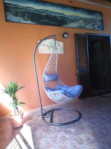 a hammock hanging from a wall in a room at Appartamento/ mansarda nel cuore del Pollino in Viggianello