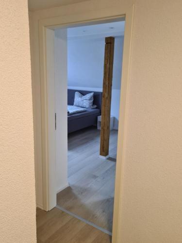 a view of a bedroom through a doorway at Ferienwohnung Ohanna Goslar in Goslar