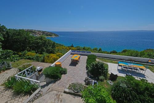an aerial view of a patio with a view of the ocean at The View Stara Baška in Stara Baška