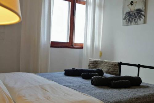 Ένα ή περισσότερα κρεβάτια σε δωμάτιο στο Casa Melchor, amanecer y trabajar mirando al mar