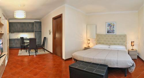 Claudio Appartamenti tesisinde bir odada yatak veya yataklar