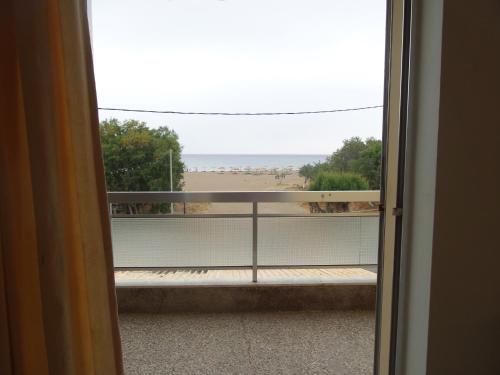 a view of a balcony from a door at Neapolis Apartments in Palaiochóra