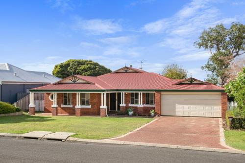 a brick house with a red roof at Seachange in Dunsborough