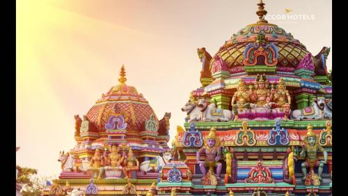 a colorful building with statues on top of it at Novotel Chennai OMR in Chennai