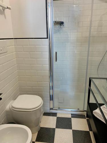 a bathroom with a toilet and a shower at HABITARE Lecce & Salento in Lecce