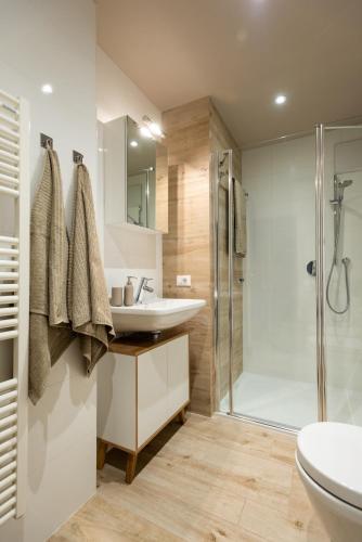 a bathroom with a sink and a shower at Avista Apartments Sky in Merano