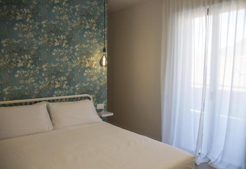 Letto o letti in una camera di Bloom Apartments