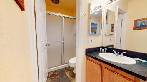 a bathroom with a sink and a toilet at Chateau De Montagne #23 Condo in Mammoth Lakes