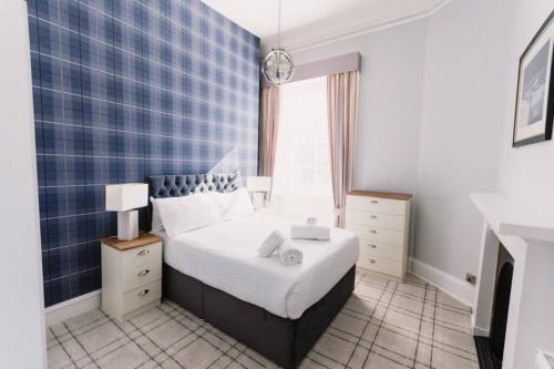 a small bedroom with a bed and a window at Stewart Apartment - A unique Apartment in countryside park with WIFI and access to bar and pool in Perth