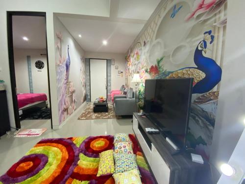 a living room with a couch and a tv at RSY guesthouse The argopuro in Berpodak