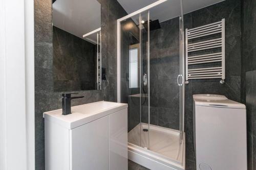 a bathroom with a toilet and a sink and a shower at Studio Matejki B in Bielsko-Biala