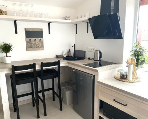 Kuchyň nebo kuchyňský kout v ubytování West Key Apartment