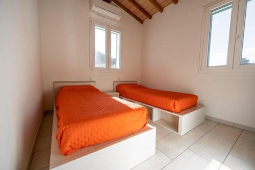 Postel nebo postele na pokoji v ubytování VILLETTA LA ZANCA